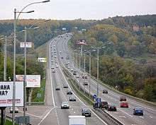 Highway with light poles and billboards