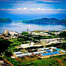 Aerial view of several buildings next to the sea