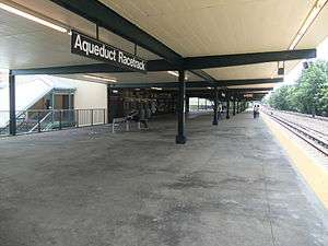 Covered platform with railroad track at right