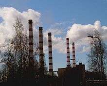 A colour photograph of the Balti Power Station, highlighting its towers against a partly cloudy sky