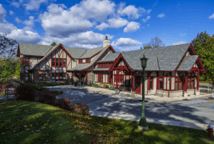 A single-story Tudor Revival-style library