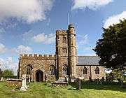 Stone building with central square tower.