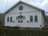 The same white building from the photograph above, viewed looking directly at the front