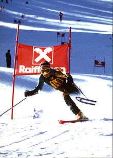 Mono-skier going down a hill