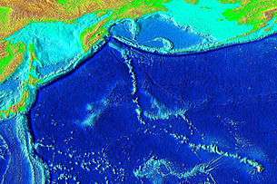 Elevation of the Pacific seafloor, showing the Hawaiian-Emperor seamount chain, including Yuryaku Seamount a bit off of the V. The sharp "V" separates the Hawaiian Ridge from the older Emperor Seamount portion of the chain. Yuryaku is the center/northernmost and most elongated of the small grouping of three fairly small volcanoes near the bend.