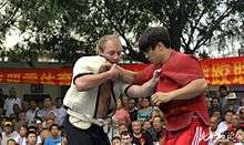 Two Shuai Jiao wrestlers testing each other in Tianjin, China.