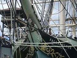 Photograph of the prow of the Falls of Clyde, featuring the female figurehead beneath the bowsprit.