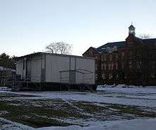 Modular building on snowy college campus.