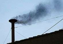 Black smoke coming from the Sistine Chapel chimney before the election of Pope Benedict XVI