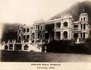 Angled view of a large 2-storey building in Indian style architecture