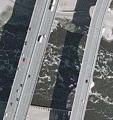 closeup aerial of a section of the bridge next to a section of the 10th Avenue bridge