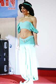 A cosplay performer dressed in full costume as Jasmine.