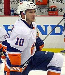 Keith Aucoin stretching on the ice.