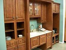 Picture of kitchen cabinet setup in a home center store.