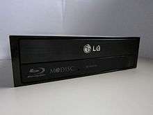 The M-DISC "swirl" logo on an LG Blu-ray optical drive.