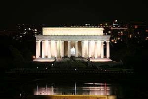 An photo a large white building with big pillars.