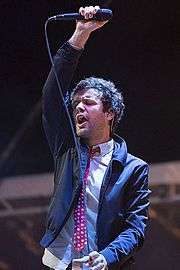 Michael Angelakos performing in 2015