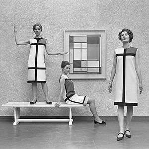 Mondrian dresses by Yves Saint Laurent shown with a Mondrian painting in 1966