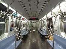 The interior of R160 car 9800, which has experimental looped stanchions