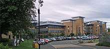 A number of sandstone-coloured buildings.