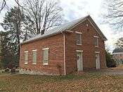 Front and side of the church; the side has three windows.