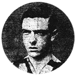 A black-and-white photograph of a white man with short hair.