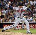 Peter Moylan partway through his pitching motion, wearing the Atlanta Braves road uniform in 2009.