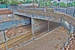 Intersection of two streets under which is a flood-control channel