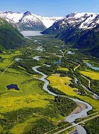 An image of a creek between two mountains