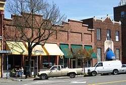 Photograph of two downtown buildings sharing a wall