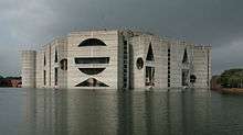 Facade of building across artificial lake
