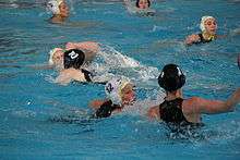 women playing water polo