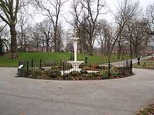 Fountain surrounded by railings in a park