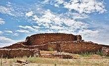 A color picture of a tall masonry tower built from tan sandstone